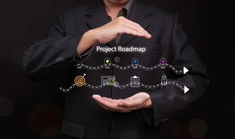 Digital project roadmap timeline with colorful phase icons in businessman h.. 스톡 사진