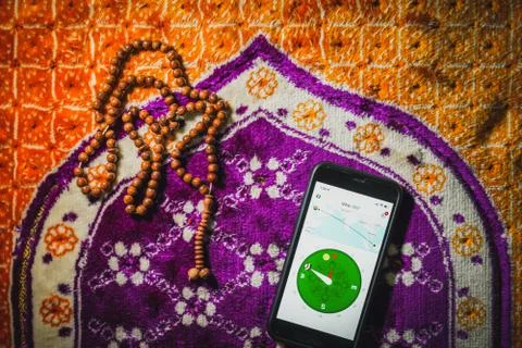 Digital Quran or Quran apps is used for muslim to read the text of Quran on a Stock Photos