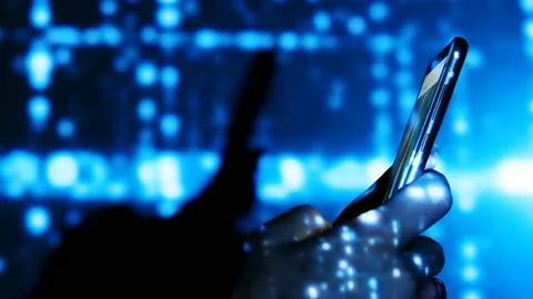 Digital rain on human hand with smartphone. Stock Footage 103714604