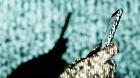Digital rain on human hand with smartphone. Stock Footage 103715415