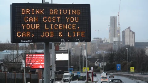 Digital roadside sign warning drivers  against drink driving leeds uk Stock Footage 121840898