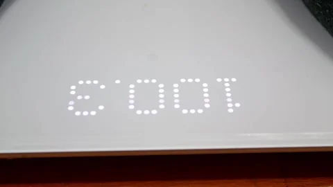 Digital scale display showing over 100kg, symbolizing obesity problem 스톡 동영상 321750164