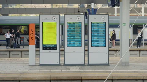 Digital schedule boards on platform of Warszawa Zachodnia station in Poland Stock Footage 334726525