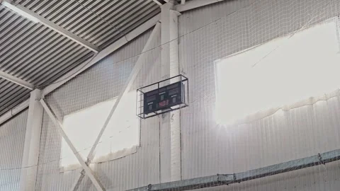 Digital scoreboard for scoring at sporting events hangs on wall in gymnasium. Stock Footage 310877947