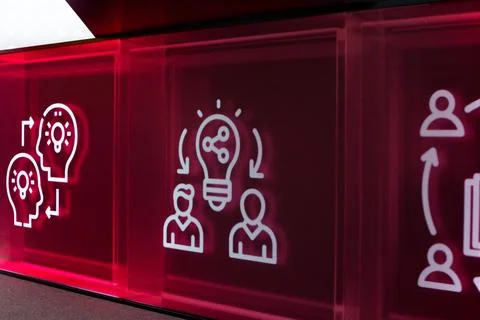 Digital screen displaying icons representing collaboration, innovation and id Stock Photos