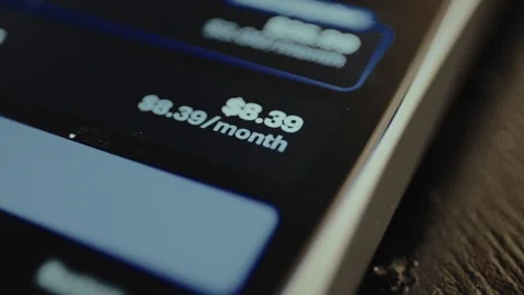 Digital screen displaying the monthly cost for a subscription for a service 스톡 동영상 328366522