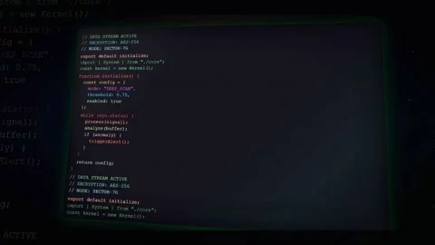 Digital screen displaying scrolling computer code and programming scripts on a Stock Footage 336774906