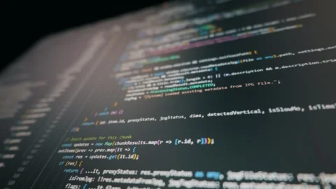 Digital screen displaying scrolling programming code in dark mode interface Stock Footage 329403143