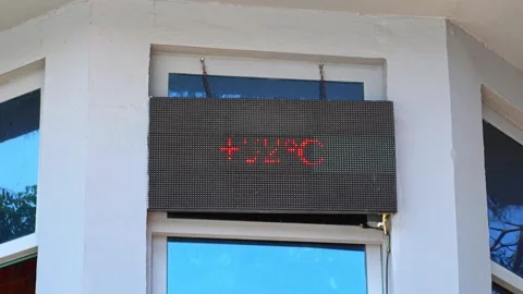Digital screen thermometer displays a temperature of up to 32 degrees Celsius. Stock Footage 311428682
