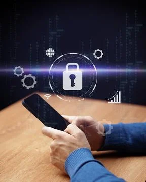 Digital security and technology concept with hands using smartphone at a wooden 写真素材