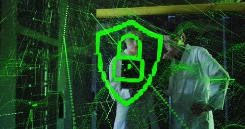 Digital security shield animating over scientists working in school laboratory Stock Footage 326039066
