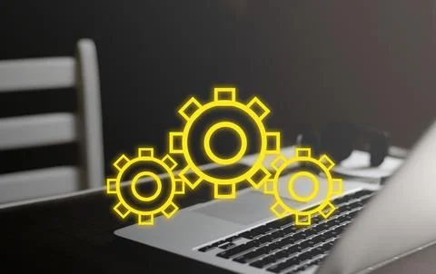 Digital settings and workflow optimization concept. Glowing yellow gears ic.. Stockfoto's