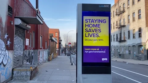 Digital sign in NYC says staying home saves lives during coronavirus Stock Footage