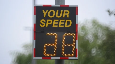 Digital sign warning drivers driving too fast to slow down uk Stock Footage 90651875