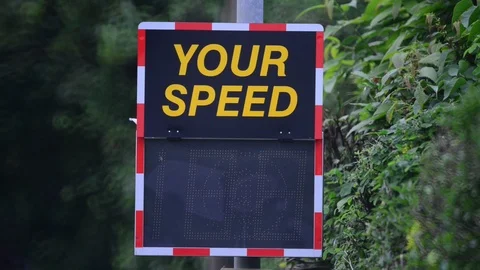 Digital sign warning drivers driving too fast to slow down uk Stock Footage 90651891
