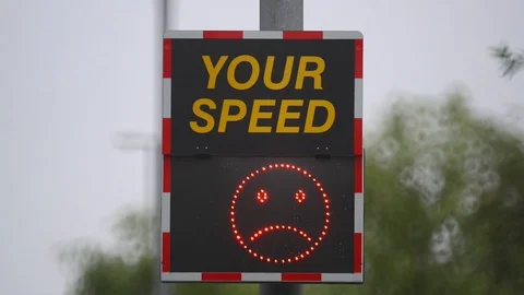 Digital sign warning drivers driving too fast to slow down uk Stock Footage 90651893