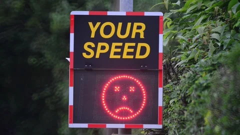 Digital sign warning drivers driving too fast to slow down uk Stock Footage 90651907