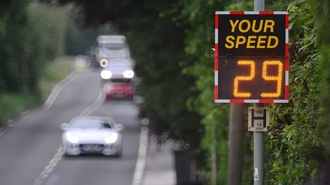 Digital sign warning drivers driving too fast to slow down uk Stock Footage 91025431