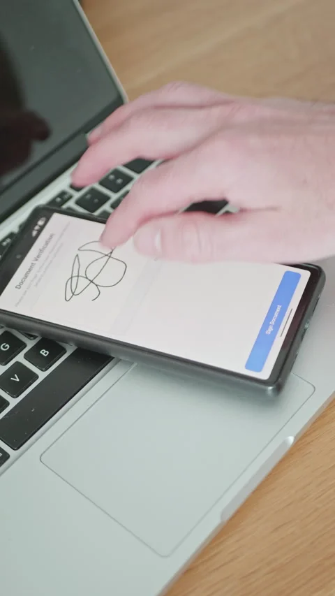 Digital signature and document verification process on a mobile phone display Stock Footage 335526736