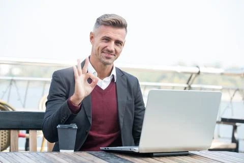 Digital strategy for evolving e-business. Happy businessman show OK ring gesture Stock Photos