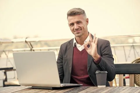 Digital strategy for evolving e-business. Happy businessman show OK ring gesture Stock Photos