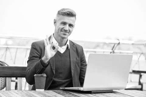 Digital strategy for evolving e-business. Happy businessman show OK ring gesture Stock Photos