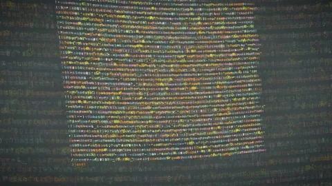 Digital stream of computer programming code scrolling on a dark screen for Stock Footage 339950788