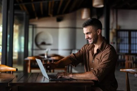 Digital success, a waiter uses a tablet for efficient service in restaurant.. Stock Photos