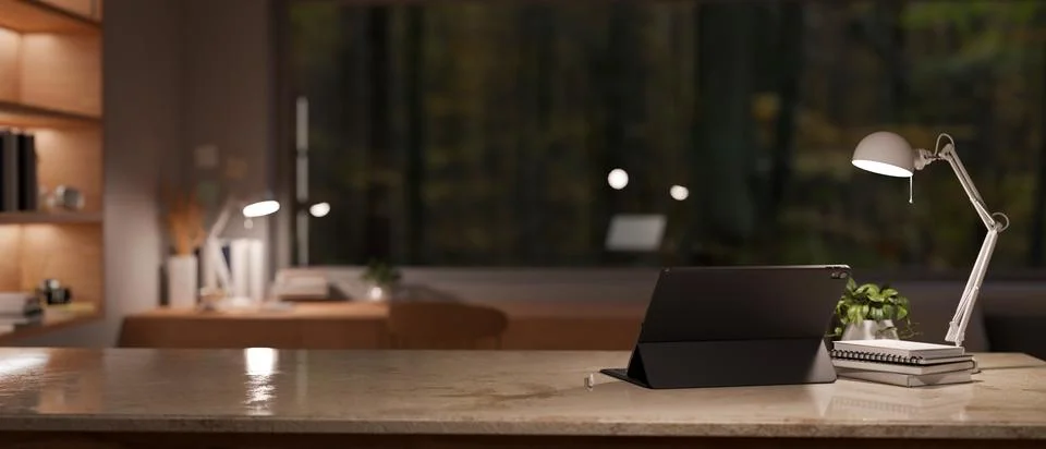 A digital tablet and a copy space on a tabletop in a modern office at night.. Stock Illustration