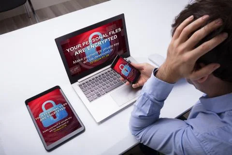 Digital Tablet And Laptop With Encrypted Text On The Screen Stock Photos