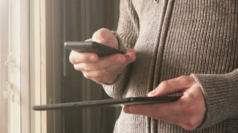 Digital tablet and mobile smart phone data synchronization Video stock 61653019