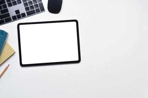 Digital tablet with blank empty screen, keyboard, mouse and notebook on white Stock Photos
