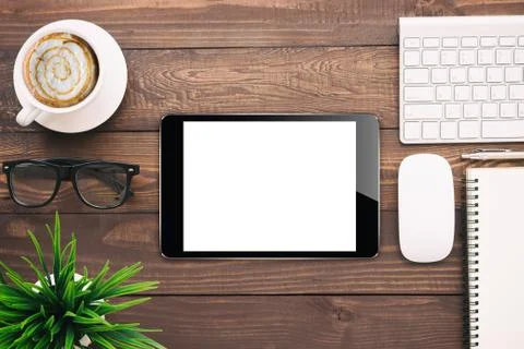 Digital tablet blank screen on work desk, mockup black tablet Stock Photos