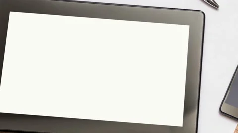 Digital tablet on business table with blank white screen and mobile phone Stock Footage 169764516