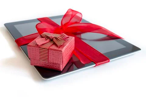 Digital tablet with christmas present Stock Photos