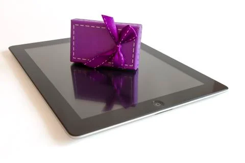 Digital tablet with christmas present 스톡 사진