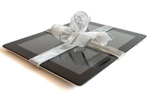 Digital tablet with christmas present 库存照片