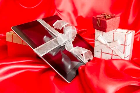 Digital tablet with christmas present Stock Photos
