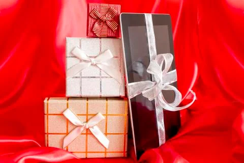 Digital tablet with christmas present 스톡 사진