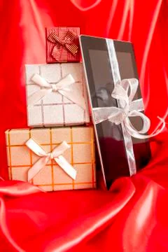 Digital tablet with christmas present 스톡 사진