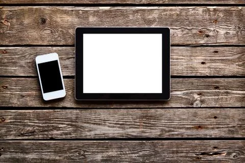 Digital tablet computer and white smart phone Stock Photos