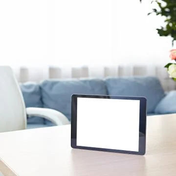 Digital tablet computer on office desk Stock Photos