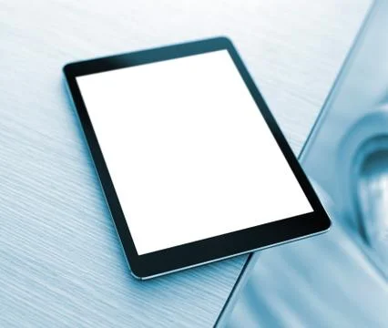 Digital tablet computer on office desk Stock Photos