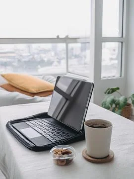 Digital tablet computer placed on the table in the living room of a condomi.. Stock Photos