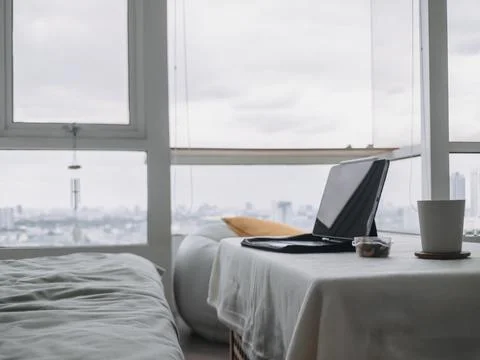 Digital tablet computer placed on the table in the living room of a condomi.. Stock Photos