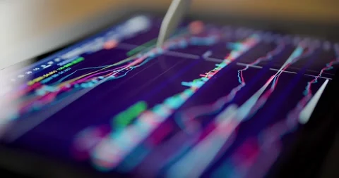 Digital tablet computer showing stock market data Stock Footage 221841487