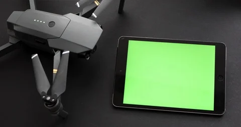 Digital Tablet Device With Blank Green Screen Connected To Copter Stock Footage 104592524