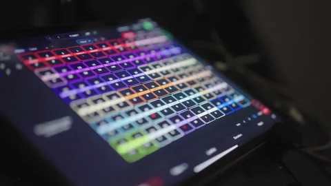 Digital tablet displaying grid interface, allowing light control and Stock Footage 323921800
