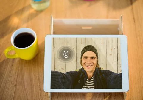 Digital tablet displaying man on video calling screen Stock Photos