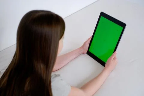 Digital tablet with empty black screen. Young girl holding tablet pc in her h Stock Photos